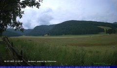 view from Webcam Cansiglio - verso la piana dei "Bech" on 2025-07-06